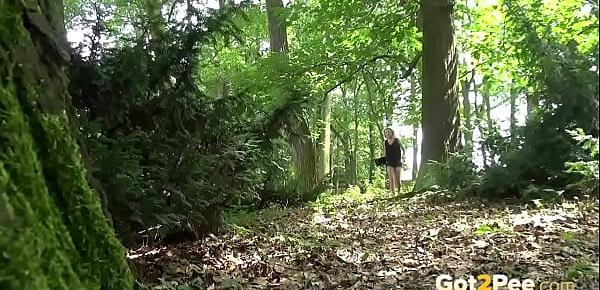  Blonde gushes piss while in the woods